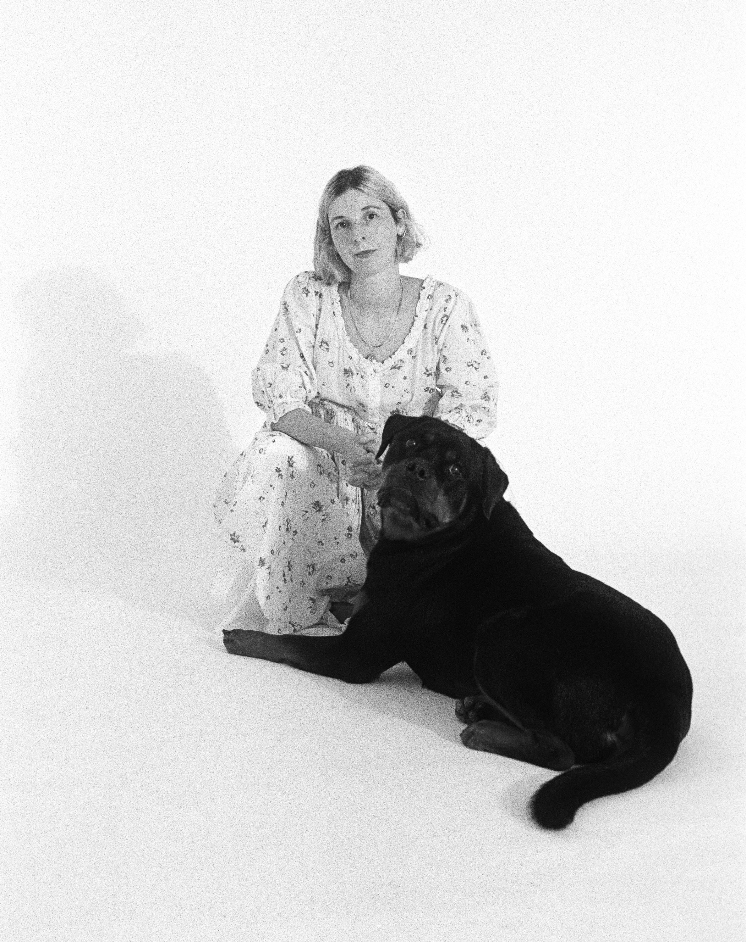 Elizabeth Goodman and her Rottweiler Atticus on a white backdrop