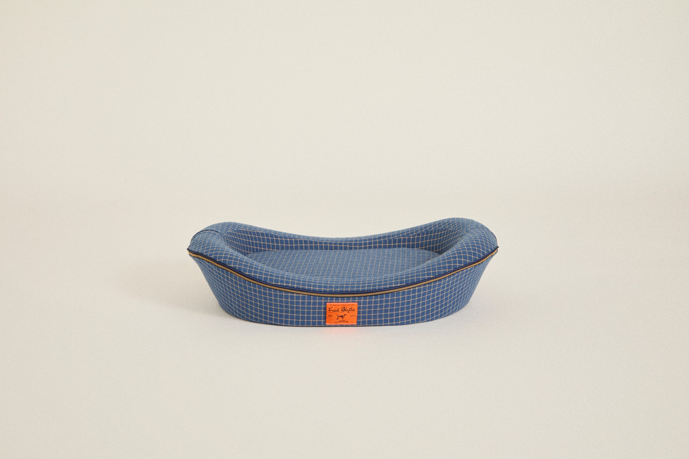 Unique dog bed in blue on white background
