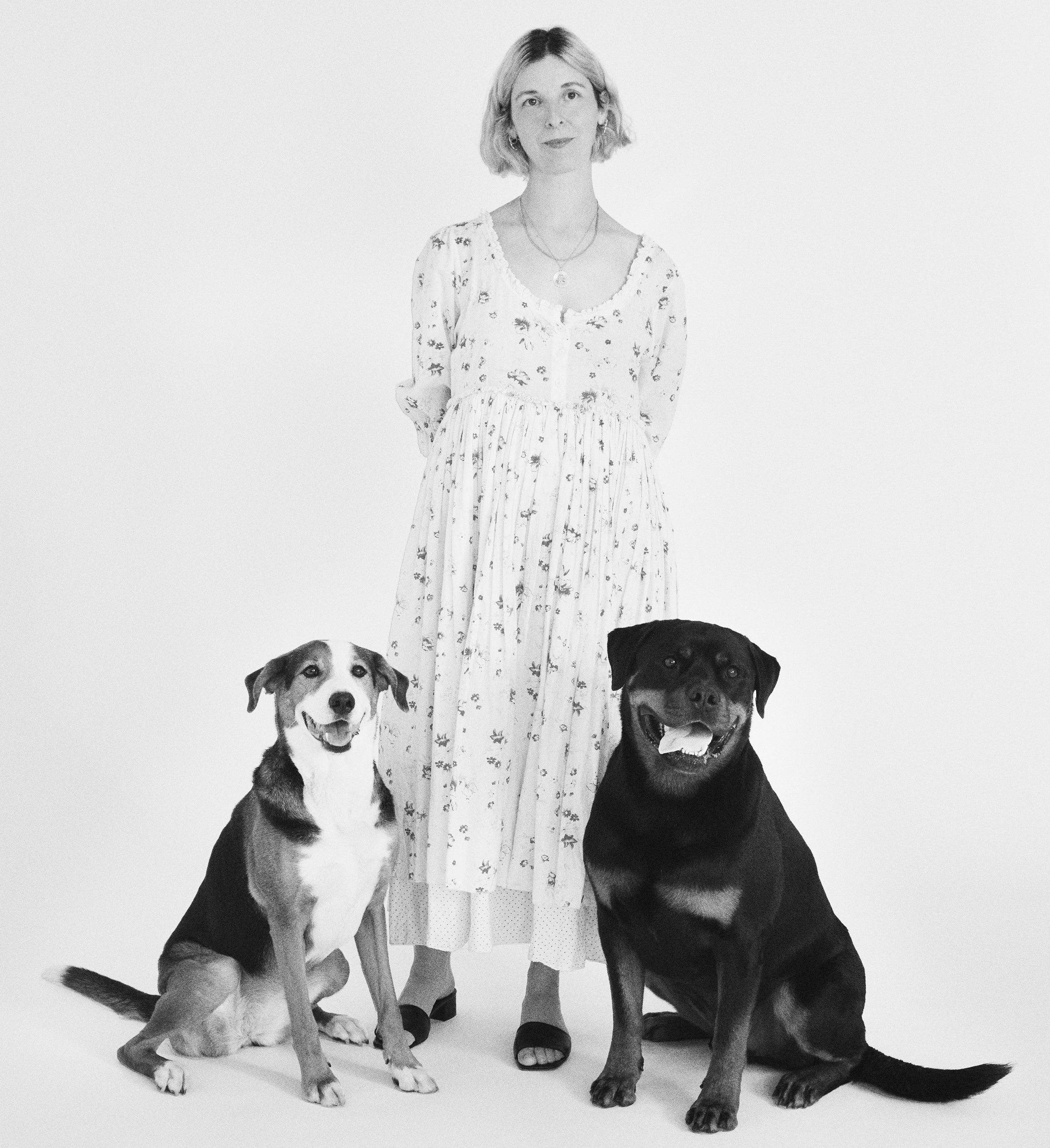 Elizabeth Goodman with her Rottweiler Atticus and his best dog friend Marge on a white studio backdrop
