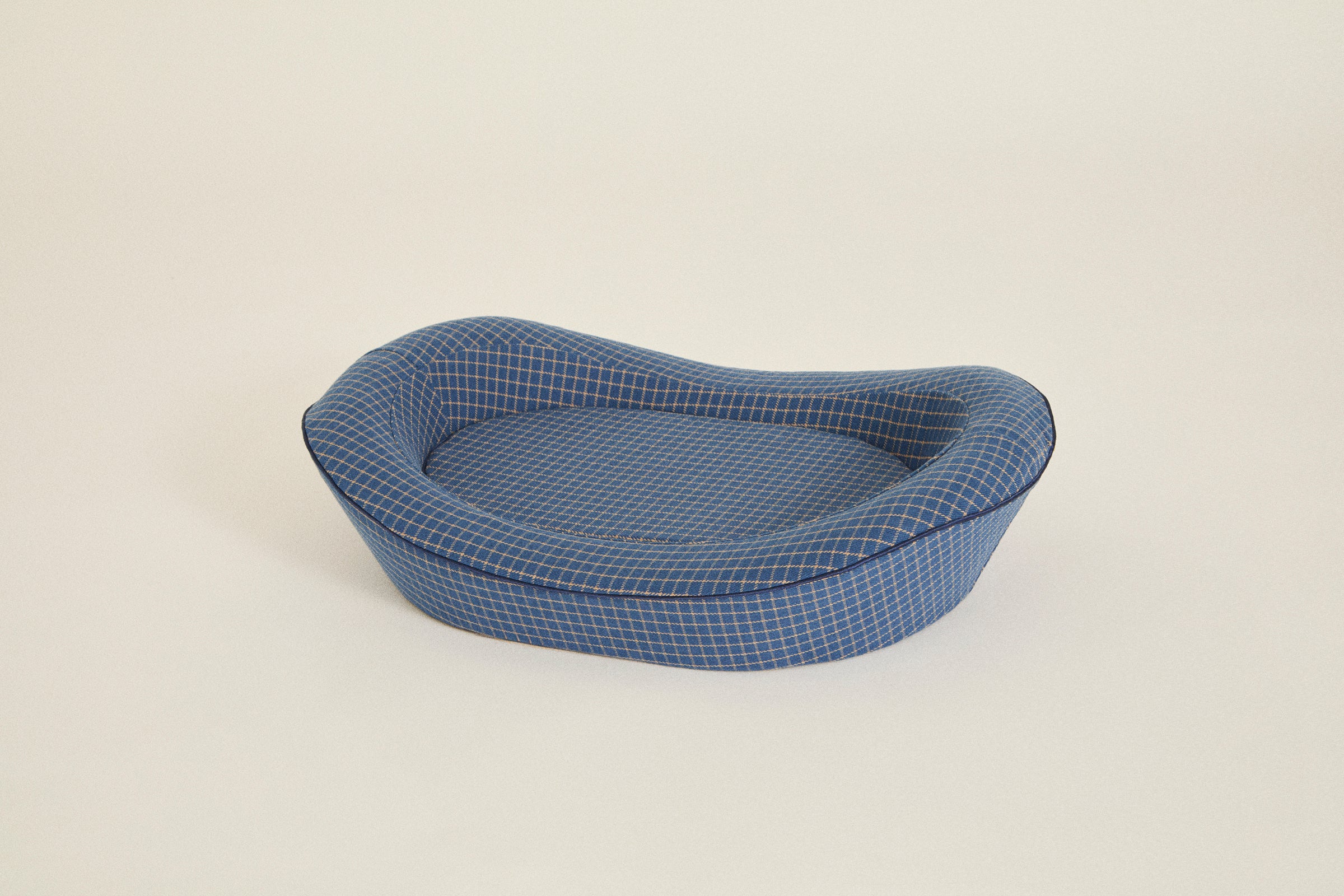 Memory foam dog bed with a blue cotton cover